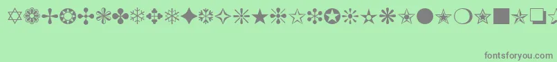 ItcZapfDingbats-Schriftart – Graue Schriften auf grünem Hintergrund