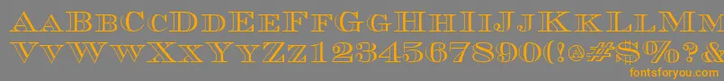 フォントCurrencyoutlineRegular – オレンジの文字は灰色の背景にあります。