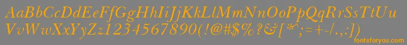 フォントBassetItalic – オレンジの文字は灰色の背景にあります。