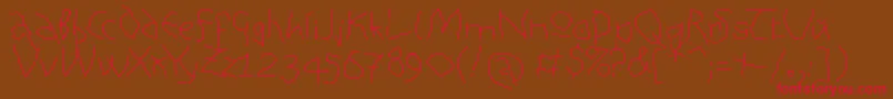 AnalphabetismMedium Font – Red Fonts on Brown Background