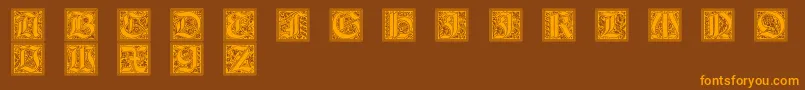 フォントGotischeInitialen – オレンジ色の文字が茶色の背景にあります。