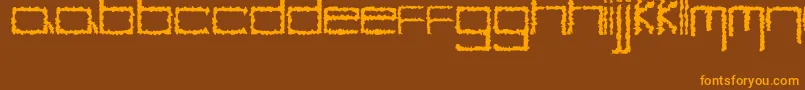 フォントYbHybrid – オレンジ色の文字が茶色の背景にあります。