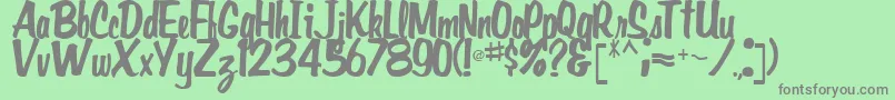 Fonte GidieonRegular – fontes cinzas em um fundo verde