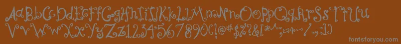 CurlyCoryphaeus-fontti – harmaat kirjasimet ruskealla taustalla