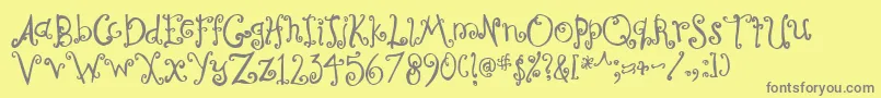 CurlyCoryphaeus-Schriftart – Graue Schriften auf gelbem Hintergrund