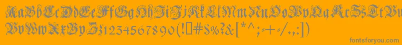 Coelnischecurrentfraktur-Schriftart – Graue Schriften auf orangefarbenem Hintergrund