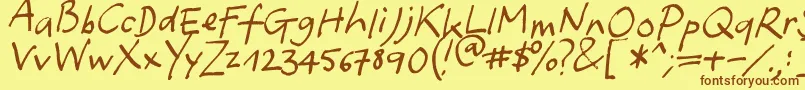 フォントYafont – 茶色の文字が黄色の背景にあります。