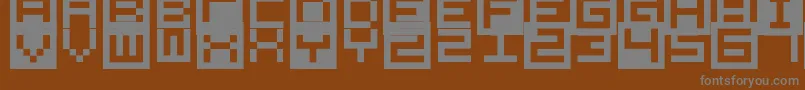 AllSquareNow-fontti – harmaat kirjasimet ruskealla taustalla