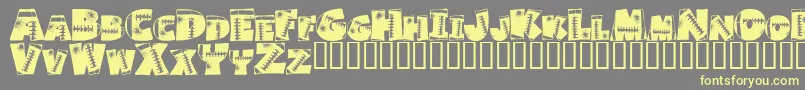 Touchdown-Schriftart – Gelbe Schriften auf grauem Hintergrund