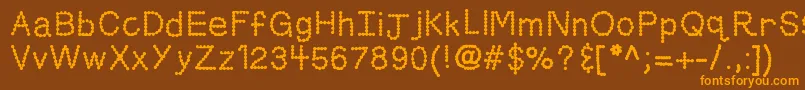 Kbskittledup-Schriftart – Orangefarbene Schriften auf braunem Hintergrund