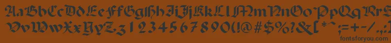 フォントPenchantRegular – 黒い文字が茶色の背景にあります