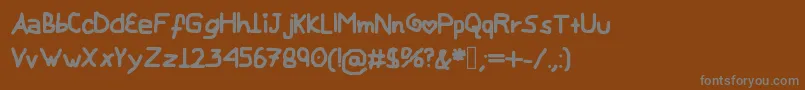 Saiba mais sobre a fonte MyChildishFont Fonte MyChildishFont – fontes cinzas em um fundo marrom