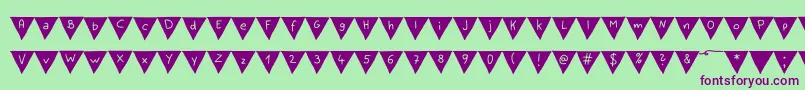 PaperBannerBold Font – Purple Fonts on Green Background