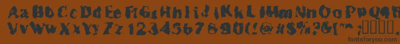 Inspector39-fontti – mustat fontit ruskealla taustalla