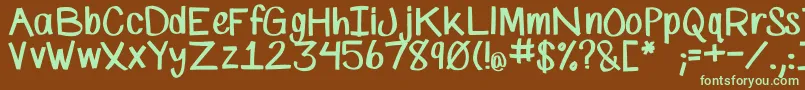 フォントSpMarkerFont – 緑色の文字が茶色の背景にあります。