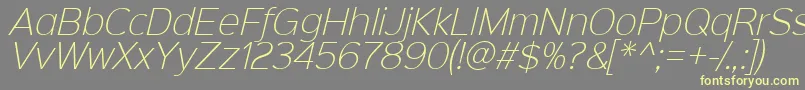 Sinkinsans200xlightitalic-fontti – keltaiset fontit harmaalla taustalla