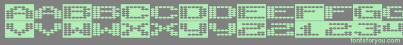 フォントSyntheticsyncronism – 灰色の背景に緑のフォント