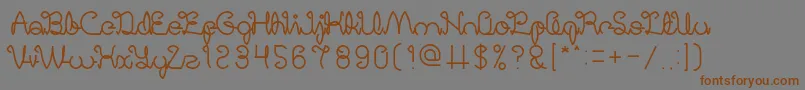 フォントDigitalHandmade – 茶色の文字が灰色の背景にあります。