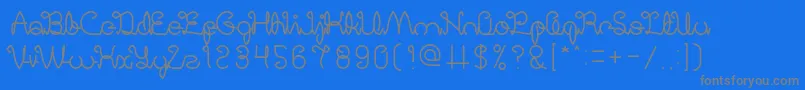 DigitalHandmade-fontti – harmaat kirjasimet sinisellä taustalla