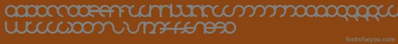 フォントMdrsfd01 – 茶色の背景に灰色の文字