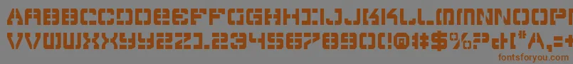 フォントVyperc – 茶色の文字が灰色の背景にあります。
