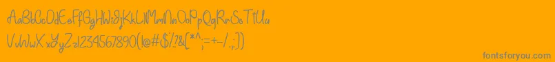 EinhornSchriftTtf-Schriftart – Graue Schriften auf orangefarbenem Hintergrund