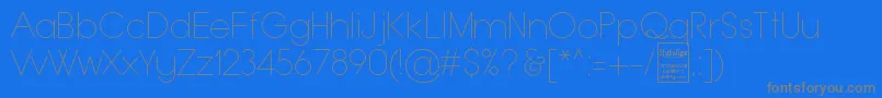 Czcionka TypoGroteskThinDemo – szare czcionki na niebieskim tle