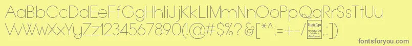 TypoGroteskThinDemo-fontti – harmaat kirjasimet keltaisella taustalla