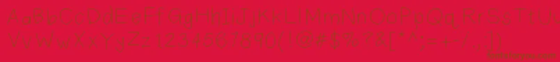 Plainprint Font – Brown Fonts on Red Background
