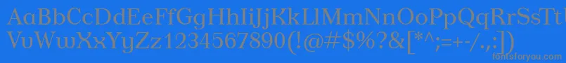 フォントTusardeco – 青い背景に灰色の文字