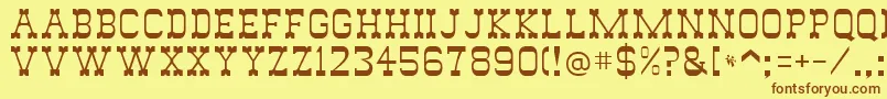 フォントWild West – 茶色の文字が黄色の背景にあります。
