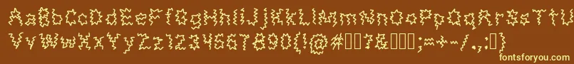 MonsterTaxi-Schriftart – Gelbe Schriften auf braunem Hintergrund