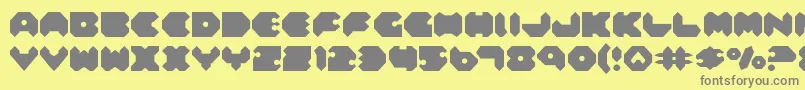 Fonte Feldercarb – fontes cinzas em um fundo amarelo