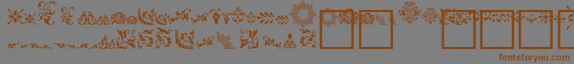 Więcej informacji o czcionce FleurdesignDingbats Czcionka FleurdesignDingbats – brązowe czcionki na szarym tle
