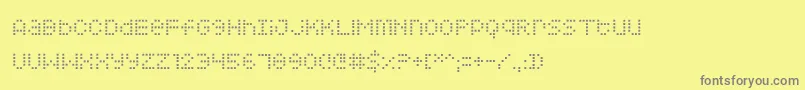 フォントSquarodynamic – 黄色の背景に灰色の文字