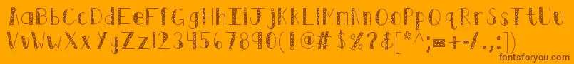 Kbswirlntwirl-Schriftart – Braune Schriften auf orangefarbenem Hintergrund