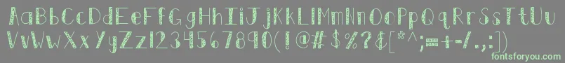 Fonte Kbswirlntwirl – fontes verdes em um fundo cinza