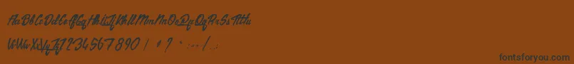 TheCitizens-Schriftart – Schwarze Schriften auf braunem Hintergrund