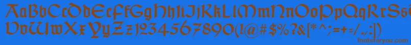 TypographerUncialgotisch-fontti – ruskeat fontit sinisellä taustalla