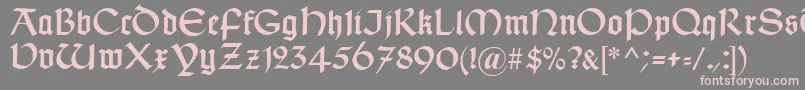 TypographerUncialgotisch-Schriftart – Rosa Schriften auf grauem Hintergrund