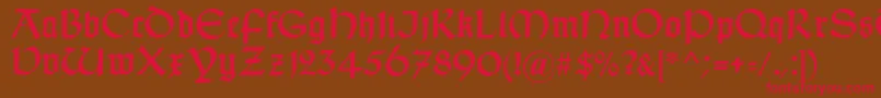 TypographerUncialgotisch-Schriftart – Rote Schriften auf braunem Hintergrund