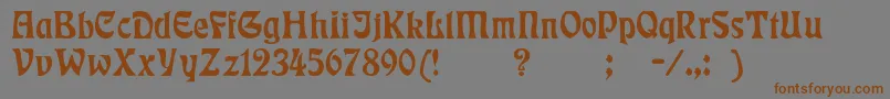 フォントBadmann – 茶色の文字が灰色の背景にあります。