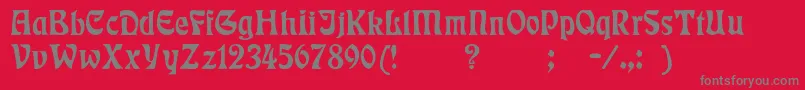 Badmann-fontti – harmaat kirjasimet punaisella taustalla