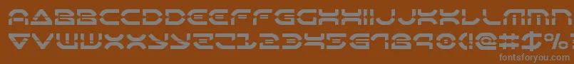 Oberondeuxlaser-fontti – harmaat kirjasimet ruskealla taustalla
