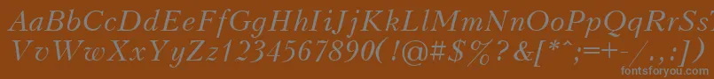 UkrainiankudriashovItalic-fontti – harmaat kirjasimet ruskealla taustalla