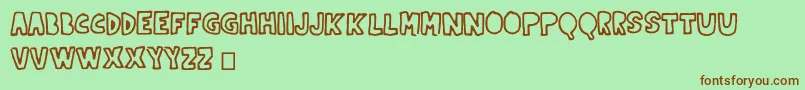 Indernikgold Font – Brown Fonts on Green Background