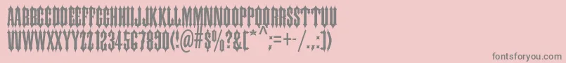 Ironwoodstd-Schriftart – Graue Schriften auf rosa Hintergrund