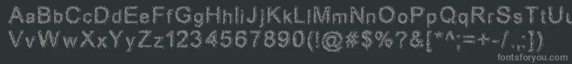 フォントAciddreamer – 黒い背景に灰色の文字
