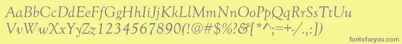 GoudyOldStyleNormalItalic-fontti – harmaat kirjasimet keltaisella taustalla