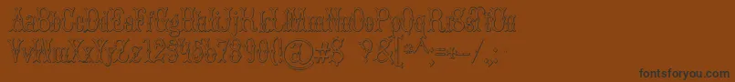 BrucedoublepicaBeveled Font – Black Fonts on Brown Background